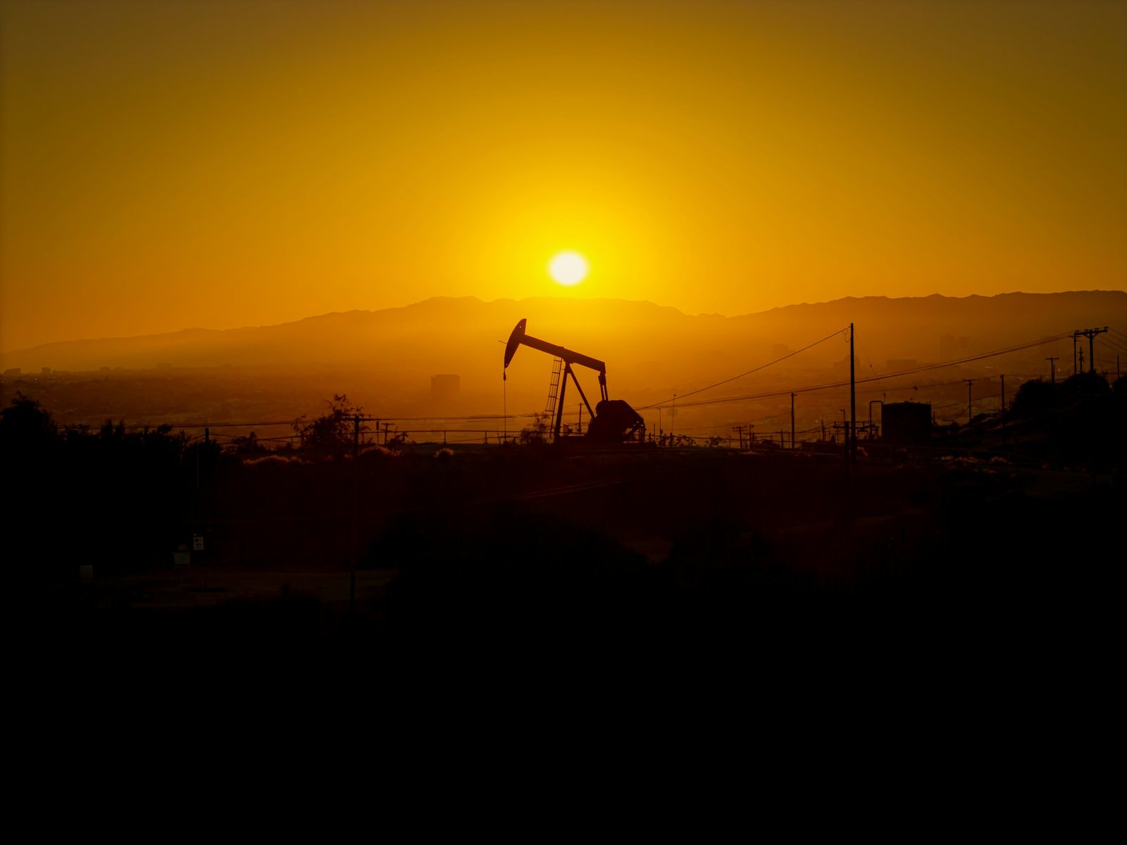 Oil field pump jacks at sunset